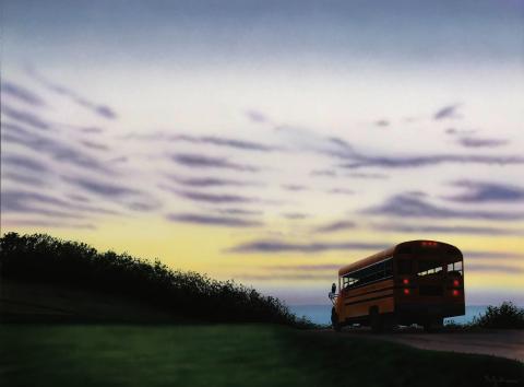 bus driving away at dawn