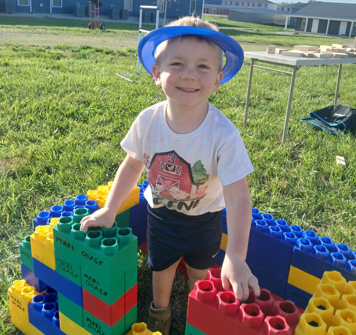 boy and giant legos