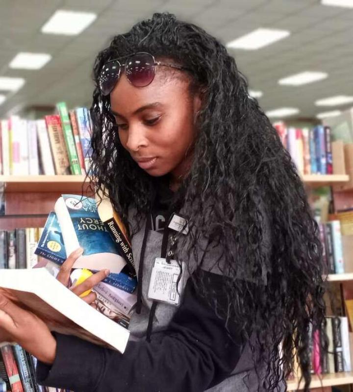 Woman looking at books 